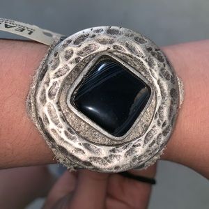 Bracelet with leather band an large black stone